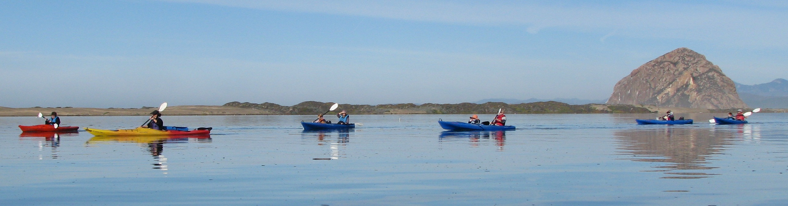 Family group kayaks on Morro Bay